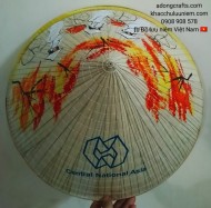 Nón lá in logo công ty và vẽ hình cô gái Việt Nam đạp xe đạp đội nón lá